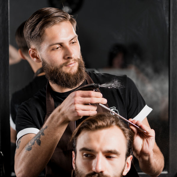 male-hairdresser-with-electric-trimmer
